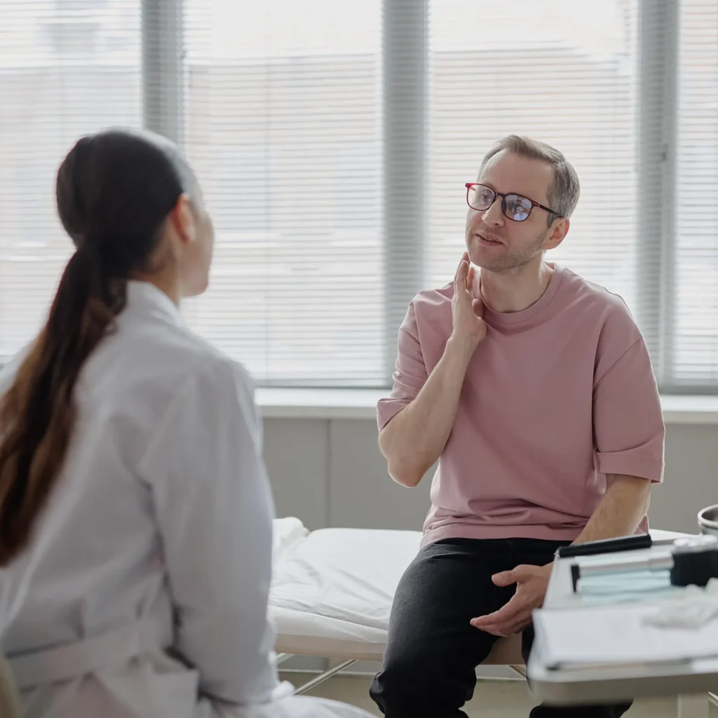 Internal medicine clinician counseling woman about preventive health and screening options 